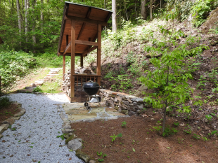 Path to slate patio and stone steps behind the house by Gonzalez Landscaping and Home Improvement