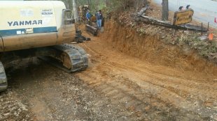 Retaining wall with railroad timbers by Gonzalez Landscaping and Home Improvement