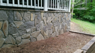 Rock veneer on exterior wall by Gonzalez Landscaping and Home Improvement